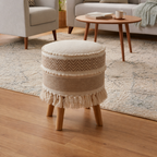 Round woven stool with fringe in a living room setting